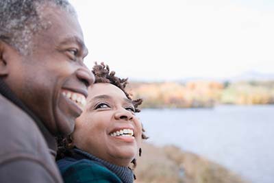 couple with dentures smiling together