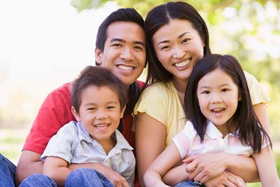 man with his family after getting his teeth cleaned in Ashland, OH